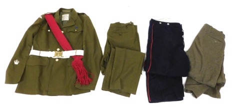 A British Army 1980 pattern No.2 dress uniform, comprising tunic and trousers, the tunic size 18/112/104, by H Edgard and Sons (London) Limited, with red sash and white leather belt with Coldstream Guards buckle, and two additional pairs of odd trousers.