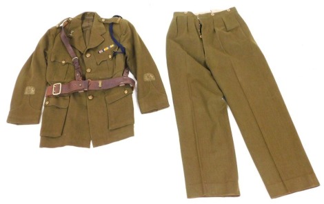 A British Army No.1 khaki officer's dress uniform, with Royal Signals insignia, comprising tunic and trousers, the tunic bearing medal ribbons for military medal 1914-18 British War medal and Victory medal, and with Sam Browne belt.