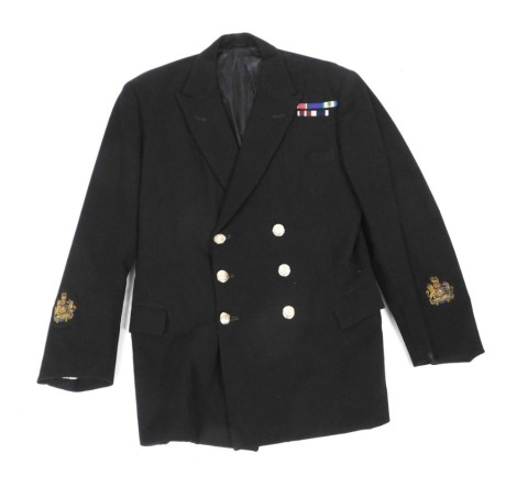 A gentleman's double breasted black evening jacket, with Royal Naval buttons and medal ribbons.