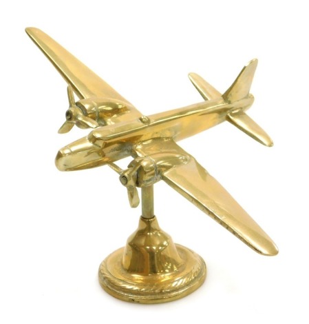 A brass model of a Wellington Bomber, on brass stand, 14.5cm high.