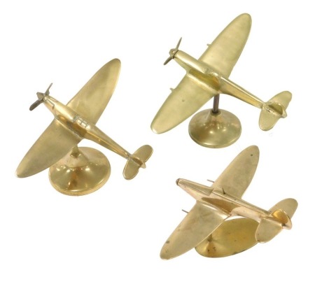 Three brass models of Spitfires, all on brass stands, the tallest 12.5cm high.