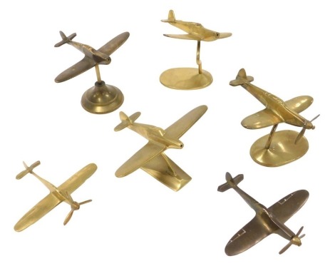 A model brass Hurricane Fighter, and other brass planes, possibly Messerschmitt. (6)