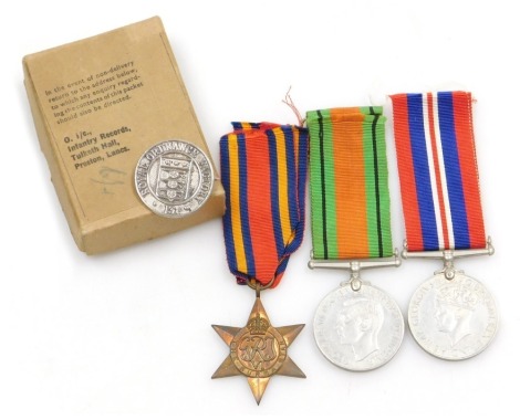 A WWII medal group, comprising 1939-45 British War medal, The Burma Star and Defence medal, together with Royal Ordnance Factory pin badge and OHMS medal postage box, addressed to RA French, Roehampton Drive, Wigston Fields Leicester, believed to be ex-Le