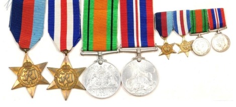 A WWII medal group, comprising 1939-45 British War medal, the 1939-45 Star, the France and German Star, and Defence medal and miniature group to match.