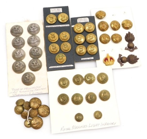 A collection of brass and other military buttons, including Royal Artillery, West Yorkshire Regiment Yeomanry, Royal Marines Light Infantry and Royal Navy, etc.