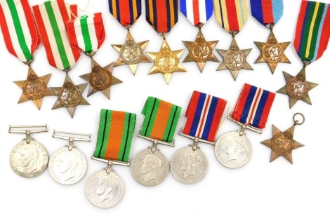 A collection of assorted WWII medals, including two 1939-45 British War medals, four Defence medals (one lacking ribbon), a 1939-45 Star (2), the Burma Star (2), the Italy Star (3), and an Africa Star, Pacific Star, and France and Germany Star. (16)