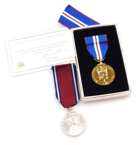 Jubilee medals, comprising George V and Queen Mary, May 1935 and Queen Elizabeth II Golden Jubilee 2002, with box and additional ribbon.