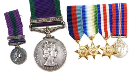 An Elizabeth II General Service medal, with Northern Ireland clasp, etc., inscribed to 24688835 Spr MR Turnbull RE (Royal Engineers), together with a General Service medal miniature with Cyprus clasp, with a WWII replica medal group comprising 1939-45 Sta