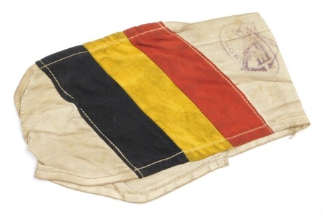 A WWII German Prisoner of War armband, bearing official stamps and numbered 7343.