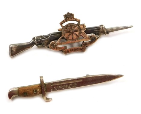 A silver and silver gilt Royal Artillery sweetheart brooch, regimental badge and rifle and bayonet, WWI period, hallmarked Birmingham 1915, with hinged pin, and an Ypres bayonet lapel pin badge.