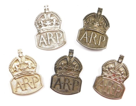 Five Air Raid Precautions lapel badges, including four ARP silver badges, two dated London 1936 and two dated London 1938, and a white metal ARP badge, including one original box, weighable silver 38.2g.