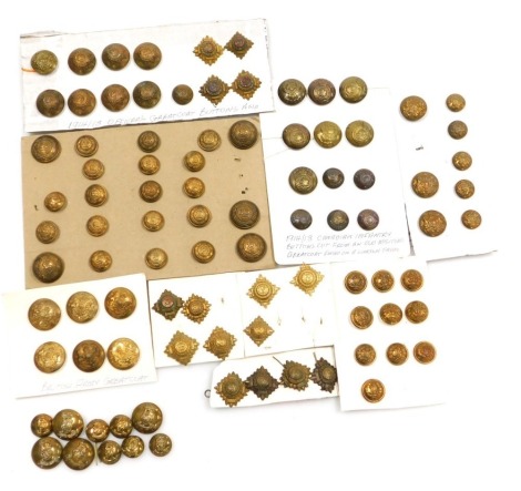 A collection of military brass buttons and rank insignia, including Canadian Infantry (WWI), etc. (1 tray)