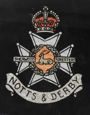 Two verre eglomise and foil regimental crests, for the Lincolnshire Regiment, 20cm x 25cm, and the Notts & Derby Sherwood Foresters, 30cm x 23cm. - 2