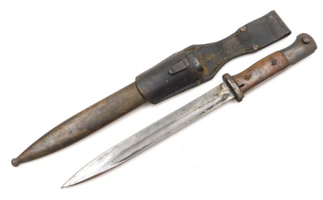 A German K98 Mauser bayonet, with 24.5cm blade, stamped WKC Solingen and number 5187d, with steel scabbard stamped number 7480, and with leather frog.