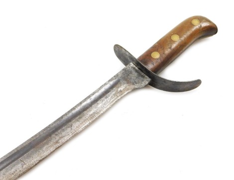 A Dutch Klewang short sword, with curved fullered blade, the ricasso stamped Hembrug, blade measures 43cm long, lacking scabbard.