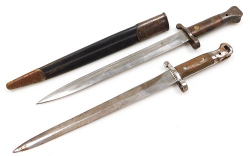 A British Army 1903 pattern SMLE bayonet by Wilkinson, the 29cm double edge blade stamped Wilkinson London to the ricasso and ER with a crown, with leather sheath stamped Wilkinson also 35W, and another British Army sword bayonet by Wilkinson of London, w