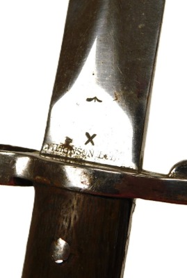 A British Army 1903 pattern SMLE bayonet by Wilkinson, the 29cm double edge blade stamped Wilkinson London to the ricasso and ER with a crown, with leather sheath stamped Wilkinson also 35W, and another British Army sword bayonet by Wilkinson of London, w - 2