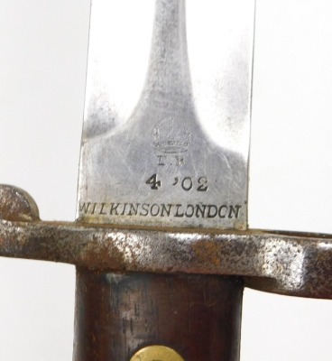 A British Army 1903 pattern SMLE bayonet by Wilkinson, the 29cm double edge blade stamped Wilkinson London to the ricasso and ER with a crown, with leather sheath stamped Wilkinson also 35W, and another British Army sword bayonet by Wilkinson of London, w - 4