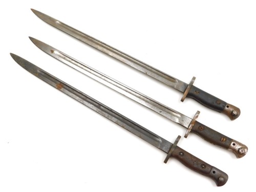 Three British Army 1907 pattern bayonets, including two by Wilkinson, marked with a crown and 1907 above Wilkinson, with further marks to each ricasso, and another for James Chapman with crown above 1907 and marked Chapman, all with 43cm blades, all lacki