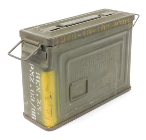 A 30 calibre M1 green steel ammunition box, with detachable lid and numerous lead shot balls.