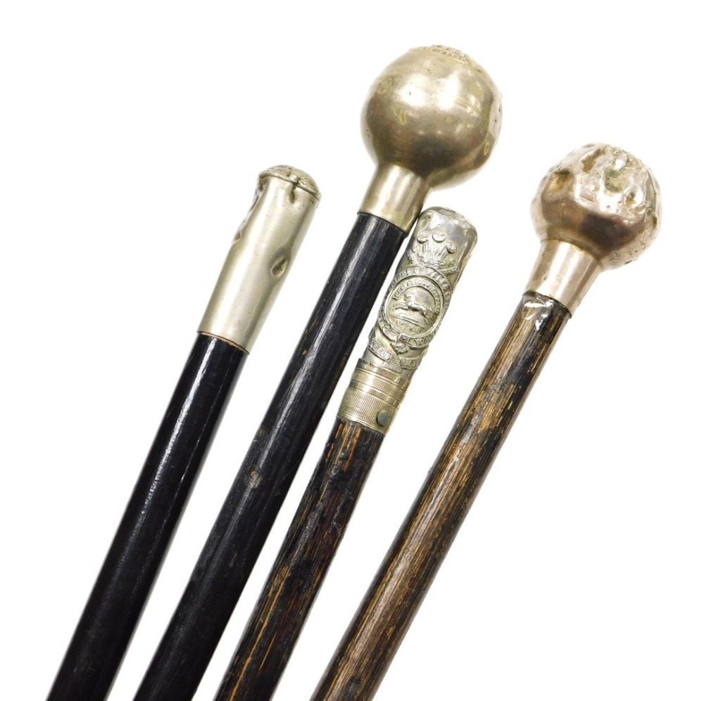 Four British Army ebonised regimental swagger sticks, one with ...