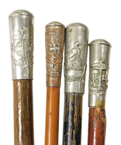 Four bamboo and malacca cane swagger sticks, two for the Boys Brigade with crested terminals Gresham's School OTC, and Westminster School OTC.