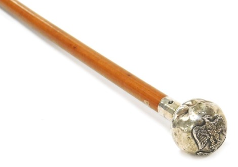 A British Army malacca cane swagger stick, with silver pommel terminal and regimental crest for the Essex Regiment, hallmarked London 1936.