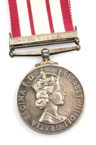 A Queen Elizabeth II Naval General Service medal, with Near East clasp, inscribed to Srg Lt L M Davis RN (Royal Navy).