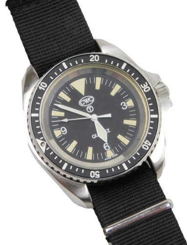 A CWC British Military quartz divers watch, stainless steel case, with black dial and bezel, luminous baton markers, the back of the case marked 0555/6645-997573314, with broad arrow over 108/97, with black woven military strap.