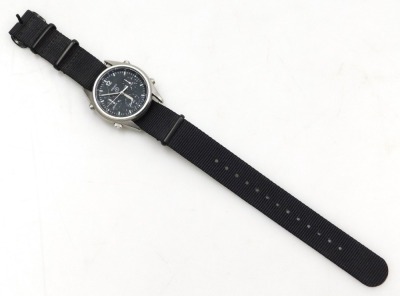 A Seiko British military chronograph watch, in stainless steel case with black dial, three subsidiary hands and date, with luminous Arabic numeral, markers and hands, the case back numbered 6645-99 1683056 with broad arrow above 2878/84, serial number 482 - 2