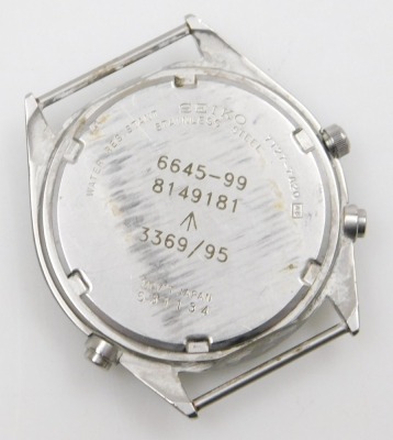 A Seiko British military chronograph watch, in stainless steel case with black dial, three subsidiary hands and date, with luminous Arabic numerals and hands, the case back numbered 6645-99 8149181 with broad arrow above 3369/95, serial number 531134, and - 2