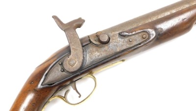 An early 19thC holster pistol, with percussion action converted from flintlock action, the side lock plate indistinctly signed possibly Brigg or Rigg, with walnut grip and stock, replacement ramrod, brass trigger guard, pommel and furnishings, 38cm long. - 2