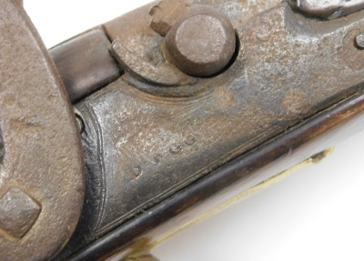 An early 19thC holster pistol, with percussion action converted from flintlock action, the side lock plate indistinctly signed possibly Brigg or Rigg, with walnut grip and stock, replacement ramrod, brass trigger guard, pommel and furnishings, 38cm long. - 5