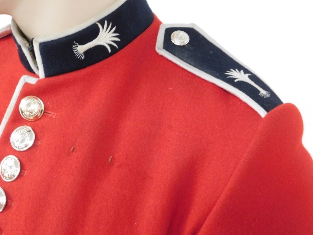 A Welsh Guards dress uniform, comprising red dress tunic, with white leather belt and bayonet scabbard, A Welsh Guards dress uniform, comprising red dress tunic, with white leather belt and bayonet scabbard,