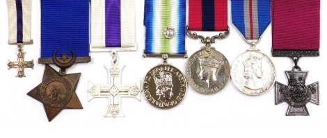 A small collection of replica medals, including Victoria Cross, Military Cross and miniature, George VI Distinguished Conduct medal, South Atlantic medal, etc. (7)