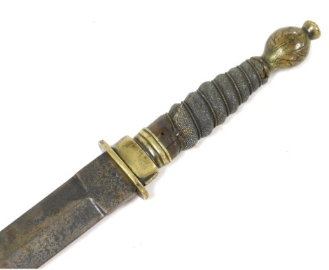 An early 19thC short sword, possibly Scottish, with double edged blade, brass hilt, shagreen bound grip, the brass pommel with rudimentary thistle engraving, length of blade 55cm, lacking scabbard.