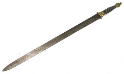 An early 19thC short sword, possibly Scottish, with double edged blade, brass hilt, shagreen bound grip, the brass pommel with rudimentary thistle engraving, length of blade 55cm, lacking scabbard. - 2