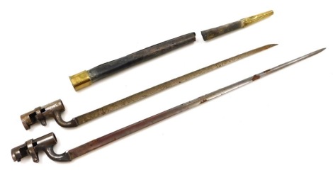 Two 19thC British socket bayonets, one with 43cm blade, and leather scabbard, the other with 54cm blade.