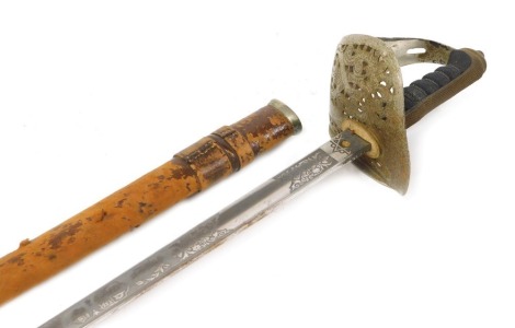 A George V 1897 pattern Infantry officer's sword, with etched fullered blade, 82cm, back stamped M7887, basket guard with GR cypher, shagreen handle, with leather bound scabbard.