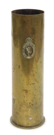 A German WWI brass ordnance shell, with the regimental crest of the Royal Corps of Signals, 27.5cm high.