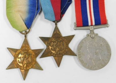 Two groups of WWII medals, relating to the Harris Brothers of Scunthorpe and comprising two 1939-45 British War medals, two Atlantic Stars, two 1939-45 Stars, a France and Germany Star (with Italy Star ribbon), and Africa Star, a collection of Naval badge - 5