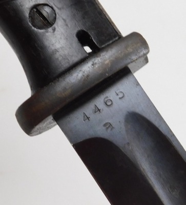 A German WWII Mauser bayonet, with 24cm fullered blade, stamped 41CUL and 4465/a on the reverse ricasso, with Bakelite grip and steel scabbard. - 2