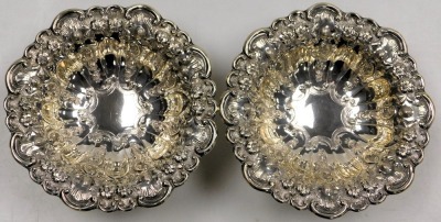 A pair of Edward VII silver sweetmeat dishes, of pedestal form, embossed with fruit, flowers and scrolling leaves, Charles Horner, Birmingham 1901, 13.91oz. - 2