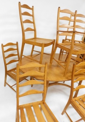 An Ercol light elm draw leaf dining table, raised on turned out swept legs, 74cm high, 162cm wide, 212cm extended, 107.5cm deep, together with eight ladder back dining chairs, comprising a carver and seven single chairs. - 3