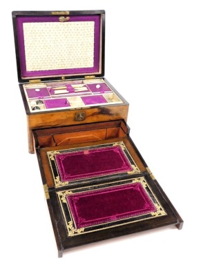 A Victorian rosewood sewing and writing box, the lid with engraved presentation plaque, opening to reveal an interior with fitted tray containing sewing accoutrements, above a drawer opening to reveal a writing slope and stationary rack, with key, 18cm hi