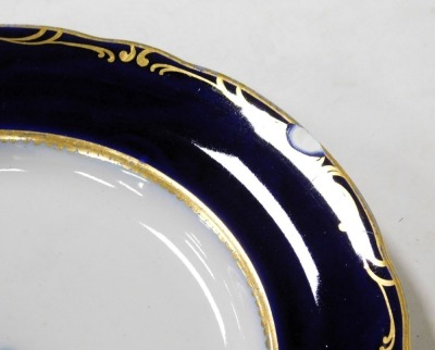 A late 19thC Davenport pottery dinner service, each bearing a crest, within a cobalt blue border, gilt heightened, bears registration mark, impressed and printed marks, comprising six graduated meat platters, soup tureen, three vegetable tureens, and two - 3