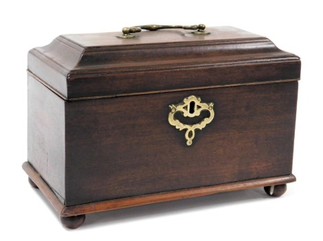 A George III mahogany tea caddy, with a brass carrying handle, the hinged lid opening to reveal three compartments, raised on ball feet, 17cm high, 25cm wide, 13.5cm deep.