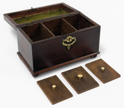 A George III mahogany tea caddy, with a brass carrying handle, the hinged lid opening to reveal three compartments, raised on ball feet, 17cm high, 25cm wide, 13.5cm deep. - 3