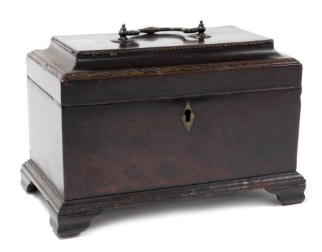 George III mahogany tea caddy, with a brass carrying handle, the hinged lid opening to reveal three recesses with metal containers, raised on bracket feet, 18cm high, 25cm wide, 15cm deep.