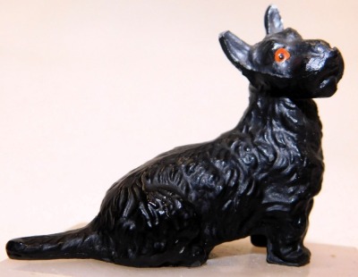 An Art Deco style cold painted metal figure of a Scottie dog, modelled in seated pose, on a white onyx base, 8.5cm wide. - 2